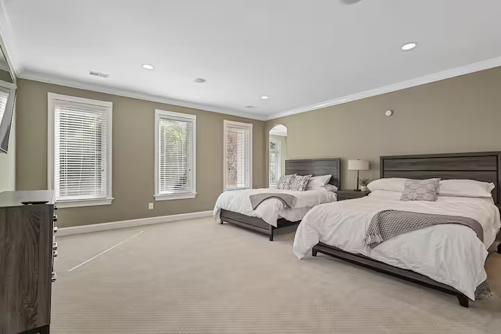 A light-filled shared guest room